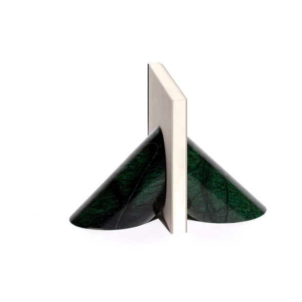 set of two cylinder of green marble cut in a triangle shape holding a white book in between
